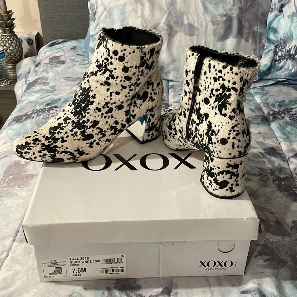 Black and white cow print ankle booties
